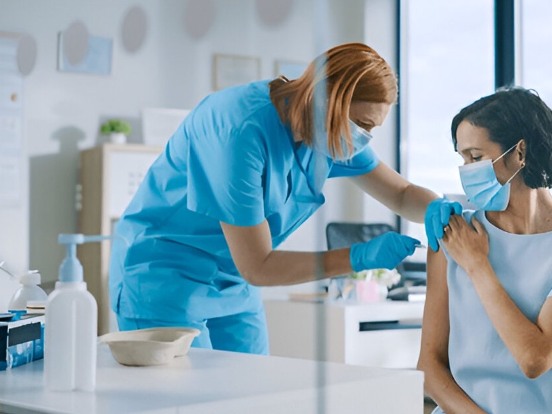 A medical professional administering an injection, not explicitly related to random drug testing programs.