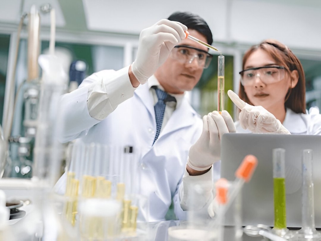  Two scientists in a lab analyzing a sample, suggesting Drug Testing Service Customization.